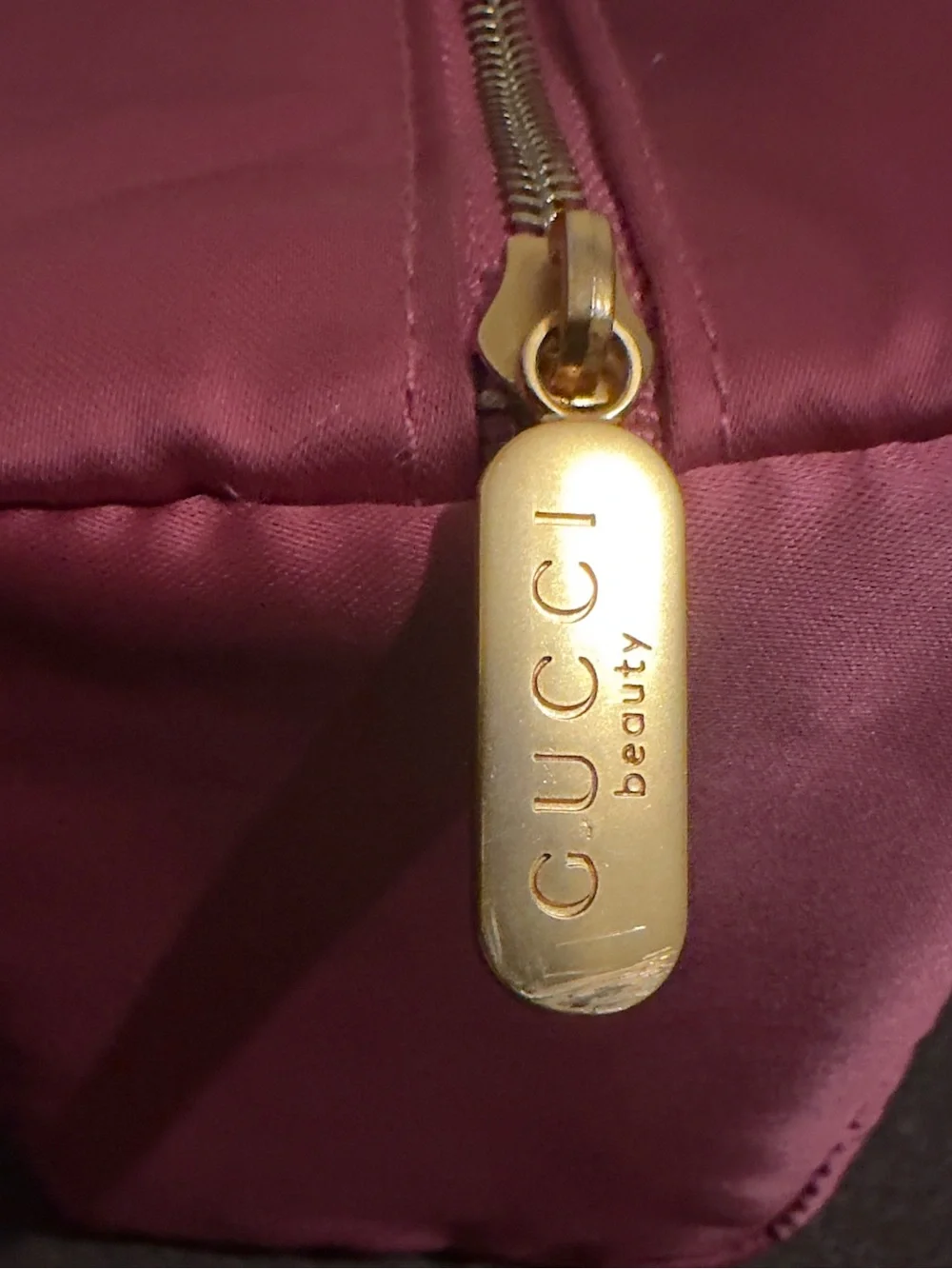 Gucci Pink Satin Beauty Pouch with Gold Logo. 7”W x 6 1/2” H.